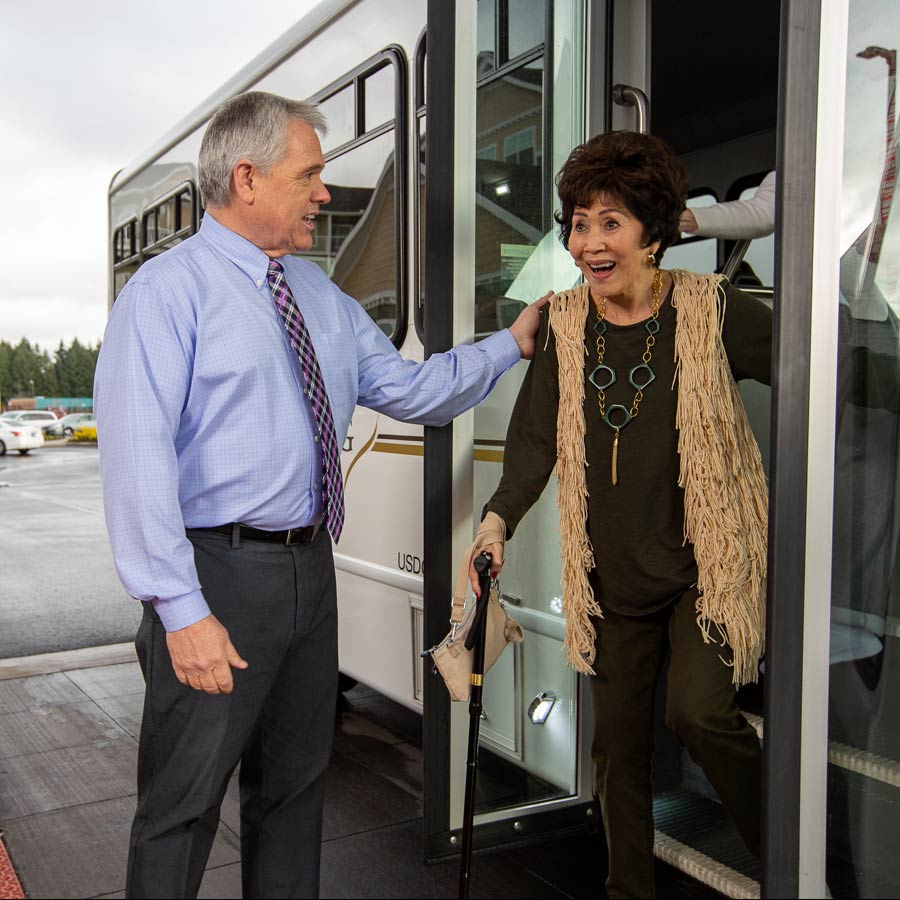 El Dorado Estates helping lady off bus